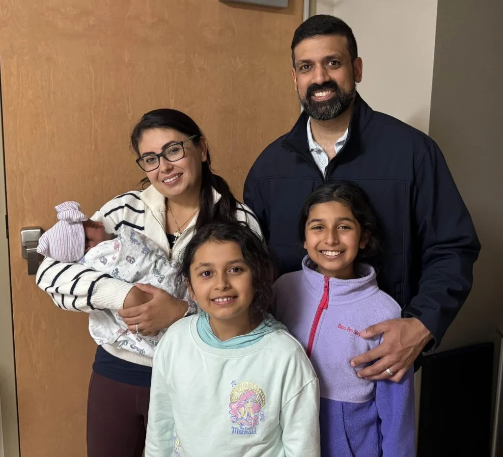 Happy adoptive family celebrating together after adoption